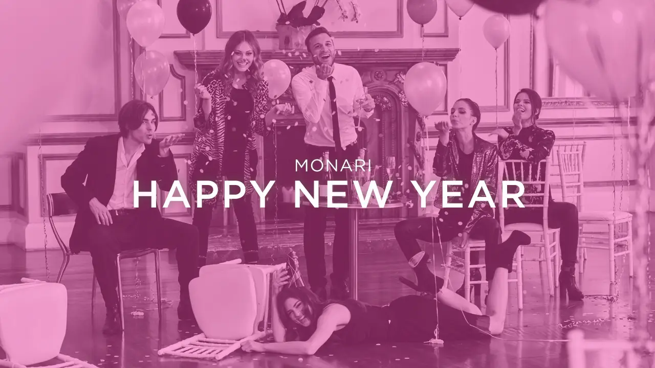 Group of friends celebrating with balloons and confetti in a decorated room with Happy New Year text overlay.