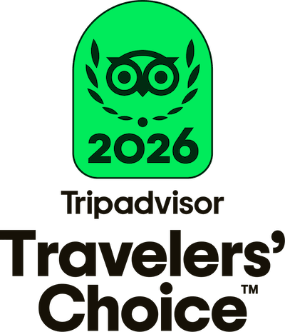 Tripadvisor Travelers' Choice 2026 badge with owl logo and laurel wreath in green and black.