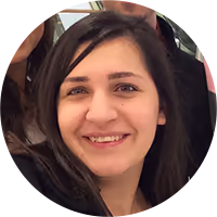 Smiling woman with dark hair wearing a black top.