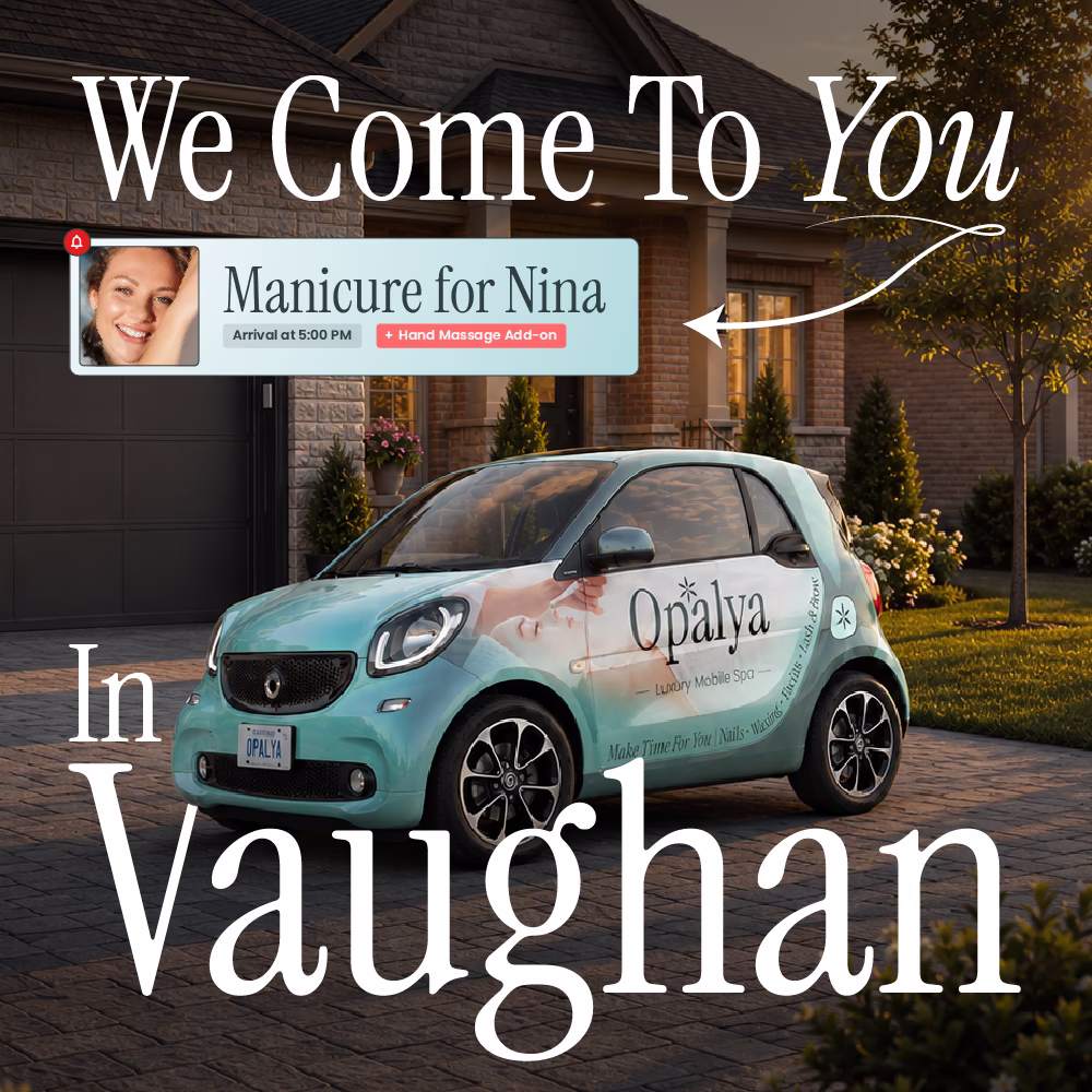Small teal car with Opalya Luxury Mobile Spa logo parked outside a house at sunset.
