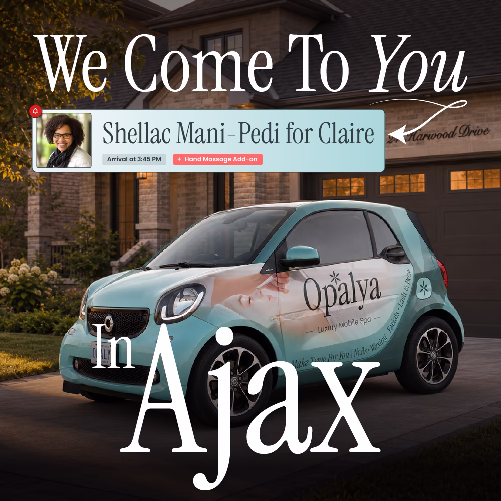 Small teal car with Opalya Luxury Mobile Spa logo parked outside a house at sunset.