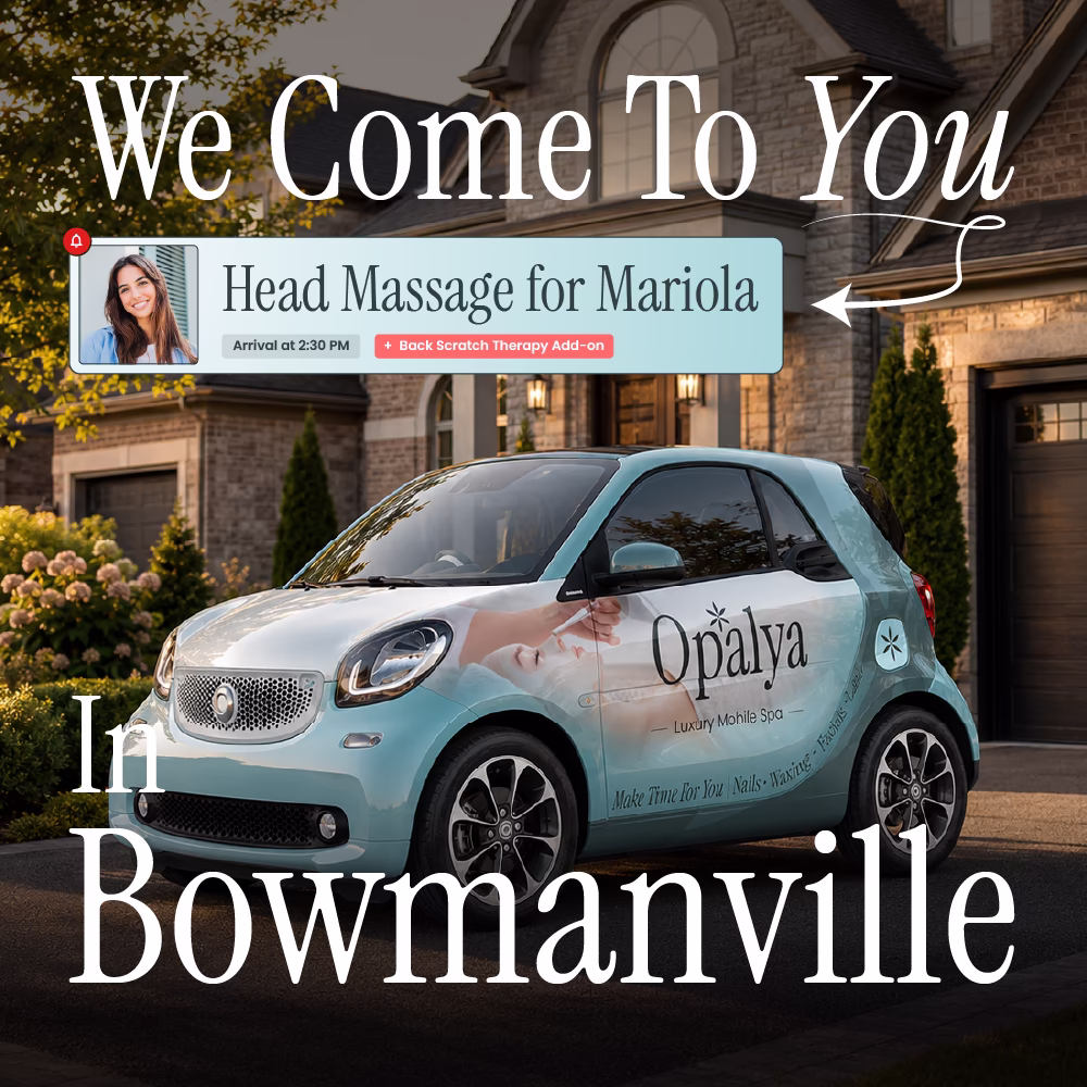 Small teal car with Opalya Luxury Mobile Spa logo parked outside a house at sunset.