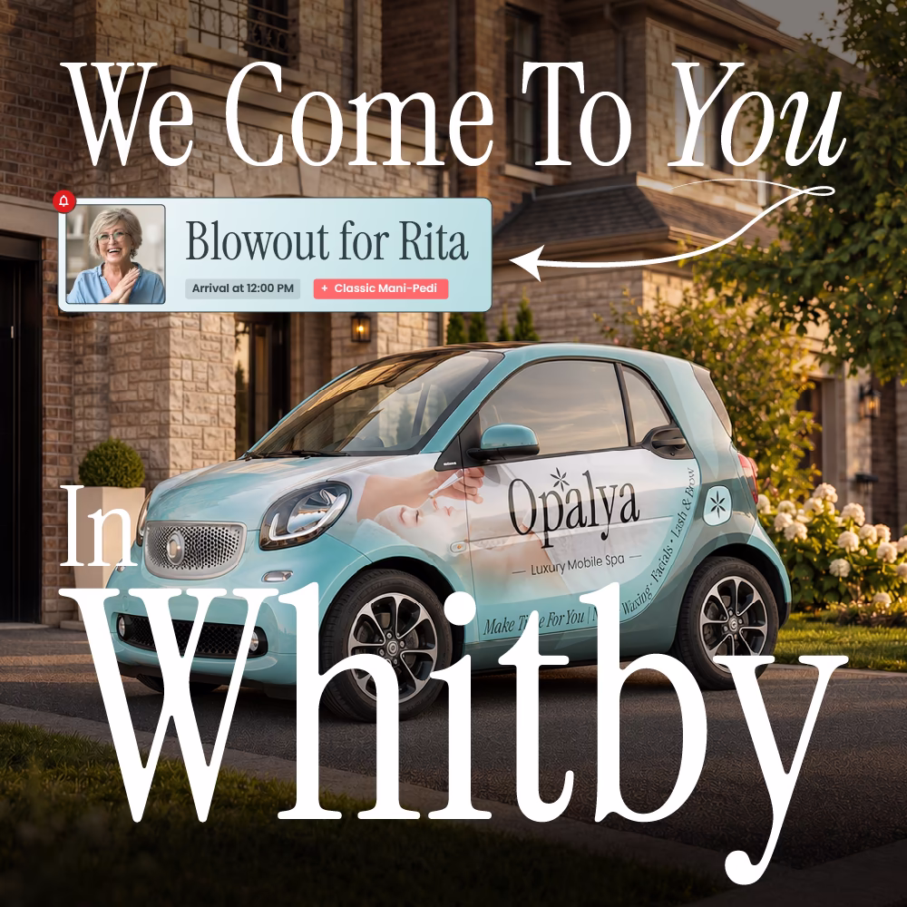 Small teal car with Opalya Luxury Mobile Spa logo parked outside a house at sunset.