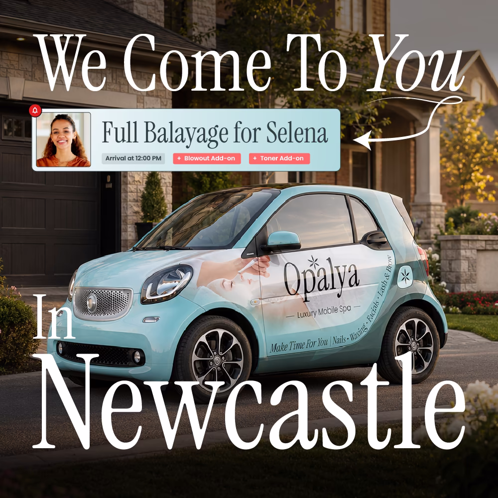Small teal car with Opalya Luxury Mobile Spa logo parked outside a house at sunset.