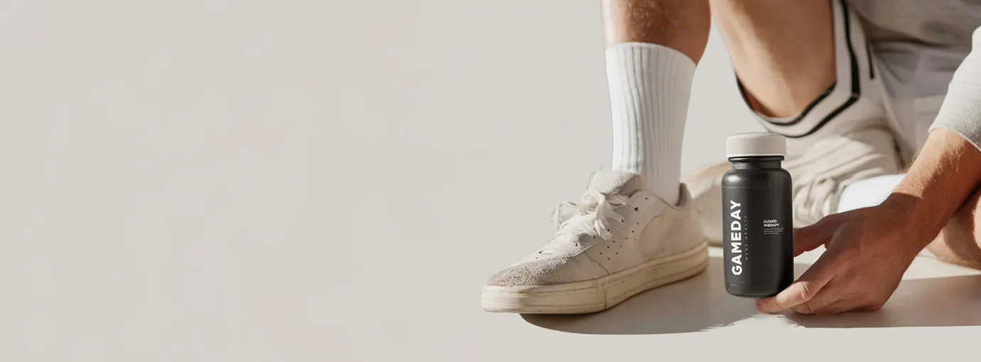 Fit man holding a Clomid pill bottle, highlighting treatment options for boosting testosterone and supporting men’s wellness.