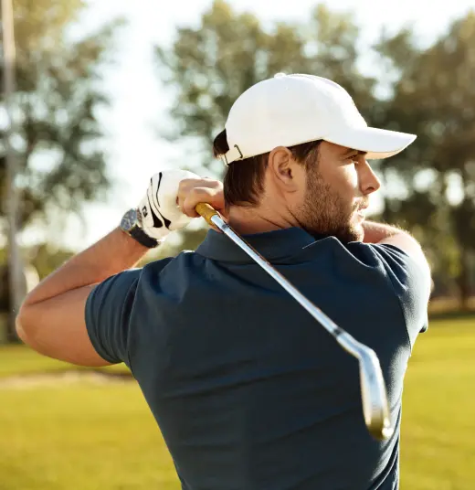 Man playing golf showcasing improved energy and focus from Clomid