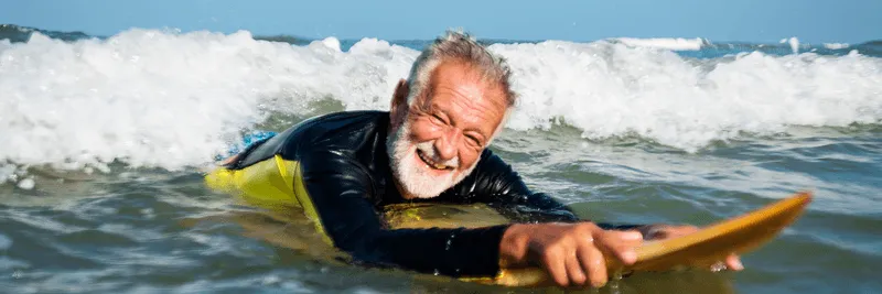 Man running near water with earphones in, reflecting boosted stamina and metabolism support from B vitamin therapy.