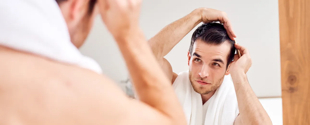 Close-up of PRP hair restoration treatment, showing a medical professional injecting the scalp to stimulate hair regrowth.
