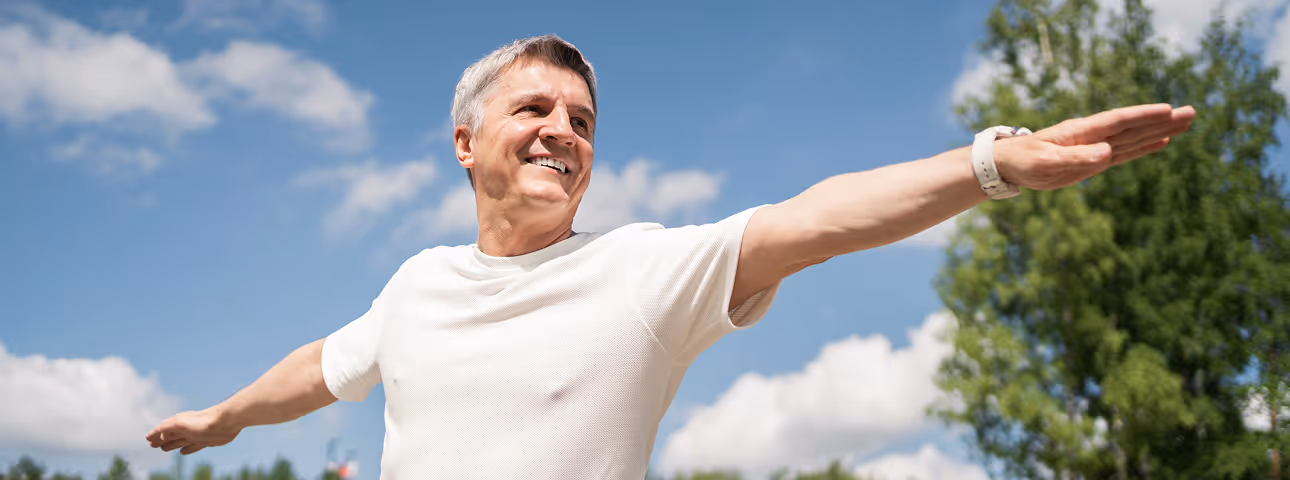 Older man enjoying active lifestyle outdoors, representing vitality and wellness from Sermorelin therapy