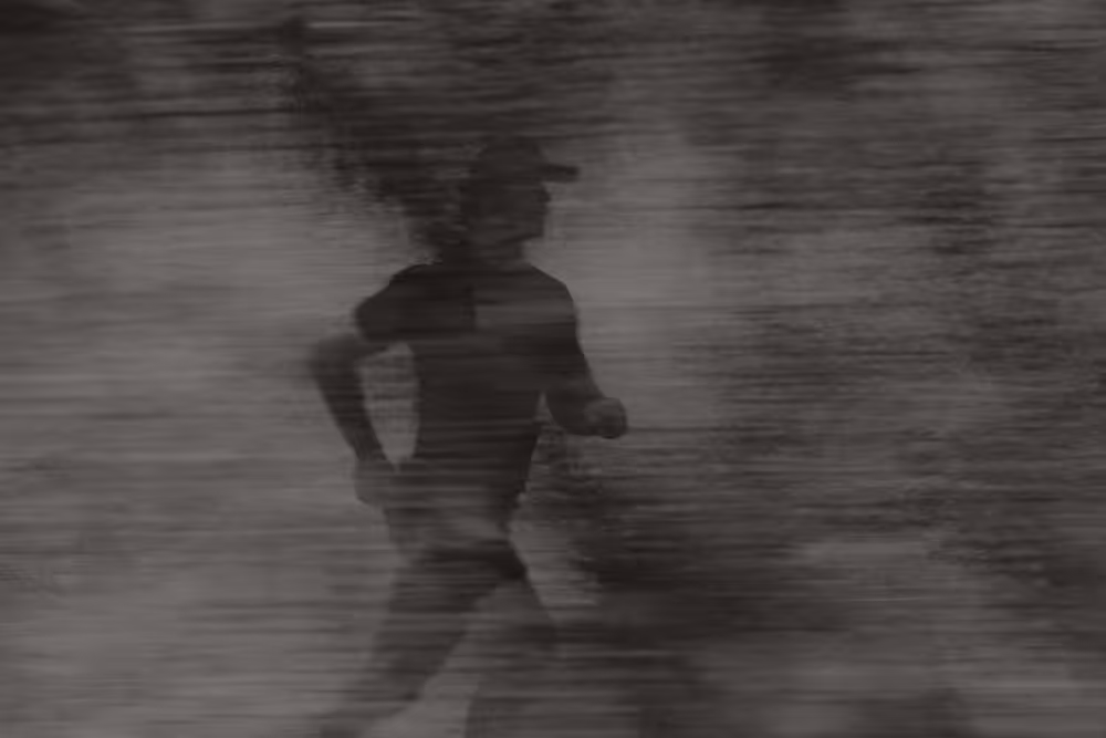 Fit man running outdoors on a clear day, symbolizing the energy, vitality, and improved performance supported by Gameday Men’s Health services.