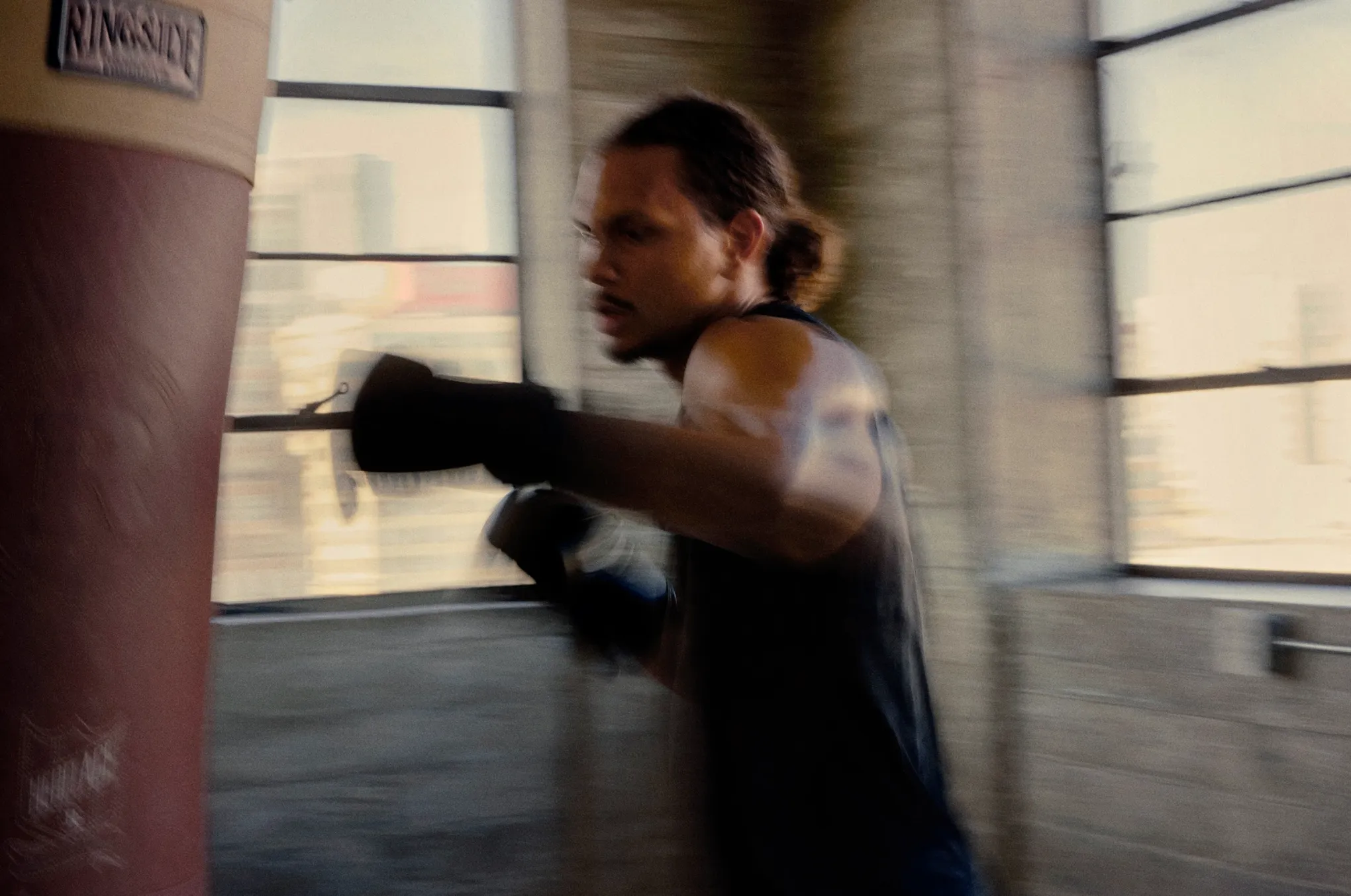Man exercising indoors, used as lifestyle imagery representing improved energy and overall wellness