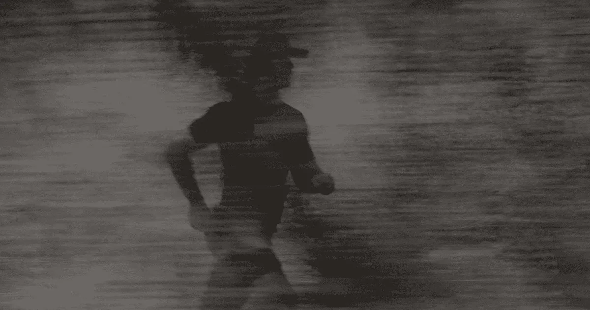 Fit man running outdoors on a clear day, symbolizing the energy, vitality, and improved performance supported by Gameday Men’s Health services.