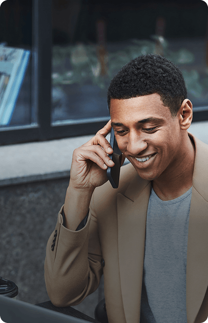 Business man talking on the phone to book an appointment.