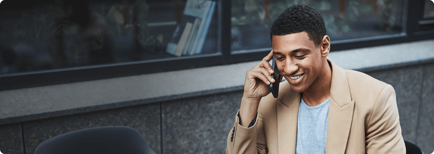 Business man talking on the phone to book an appointment.