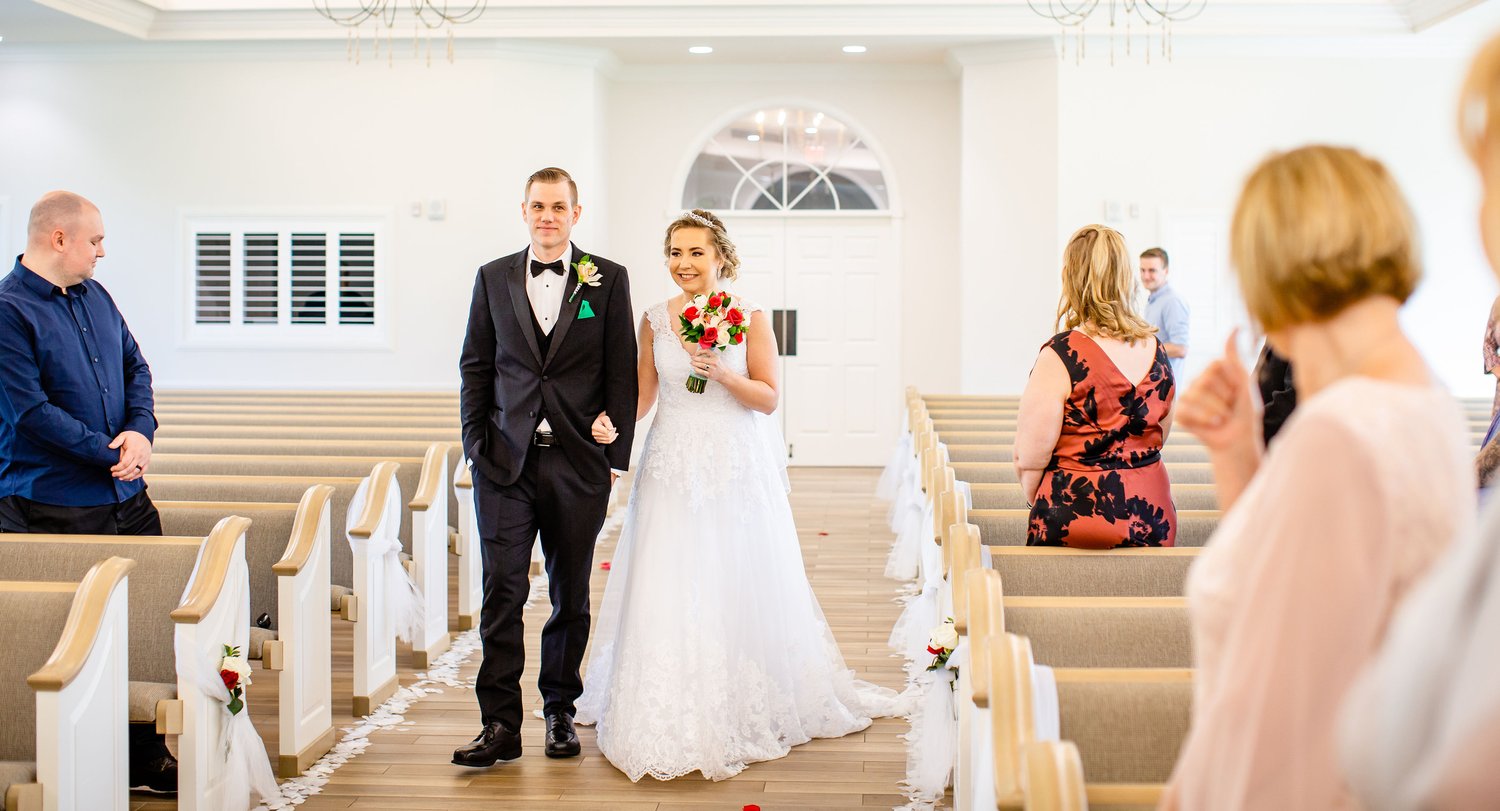 Wedding ceremony venue with elegant decor - Florida wedding videography by Mile 1 Media