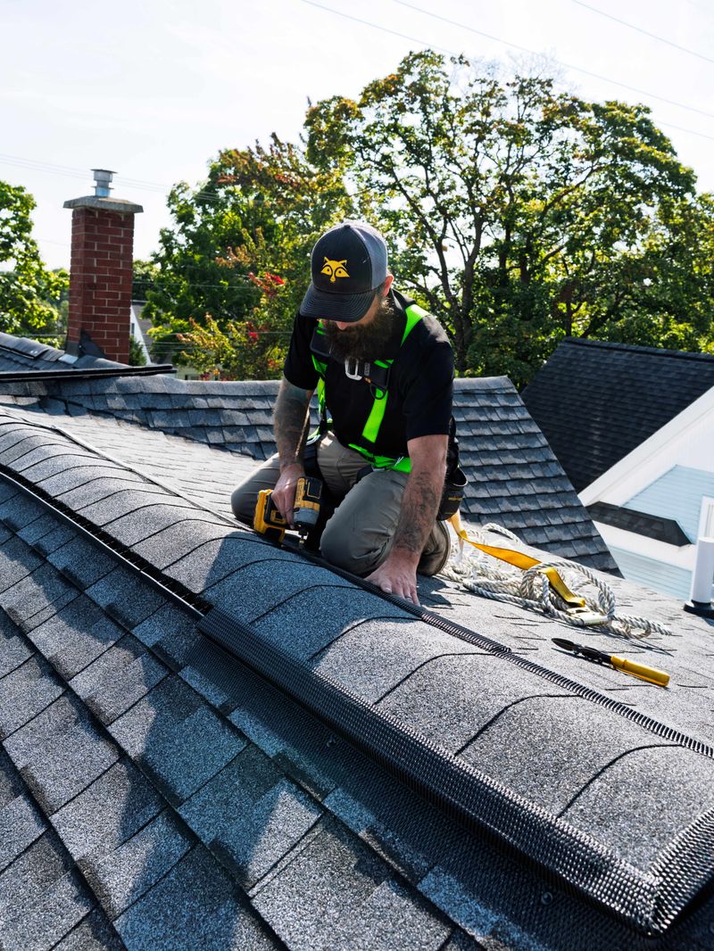 Roof technician photographed on the job for a Broward County services company