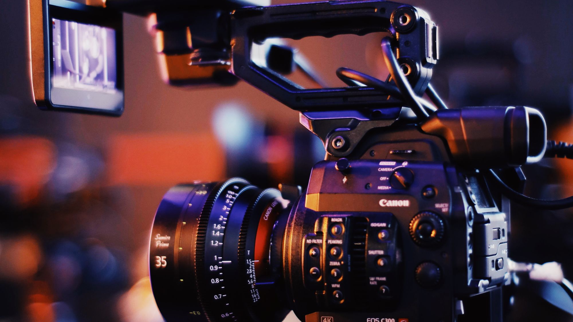 Close-up of a cinema camera lens on set during a South Florida video production shoot