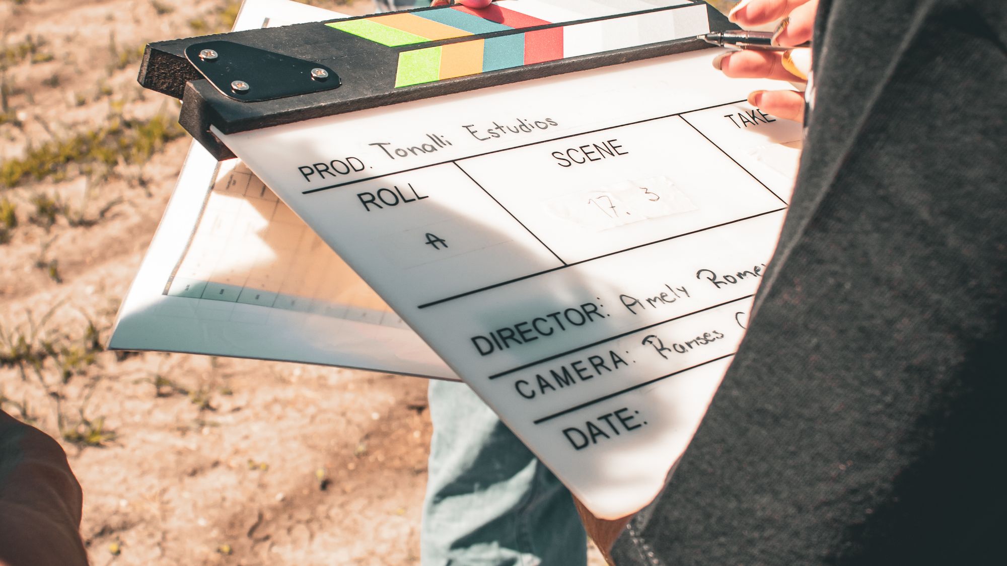 Film slate clapperboard held on set before the first take of a commercial video shoot