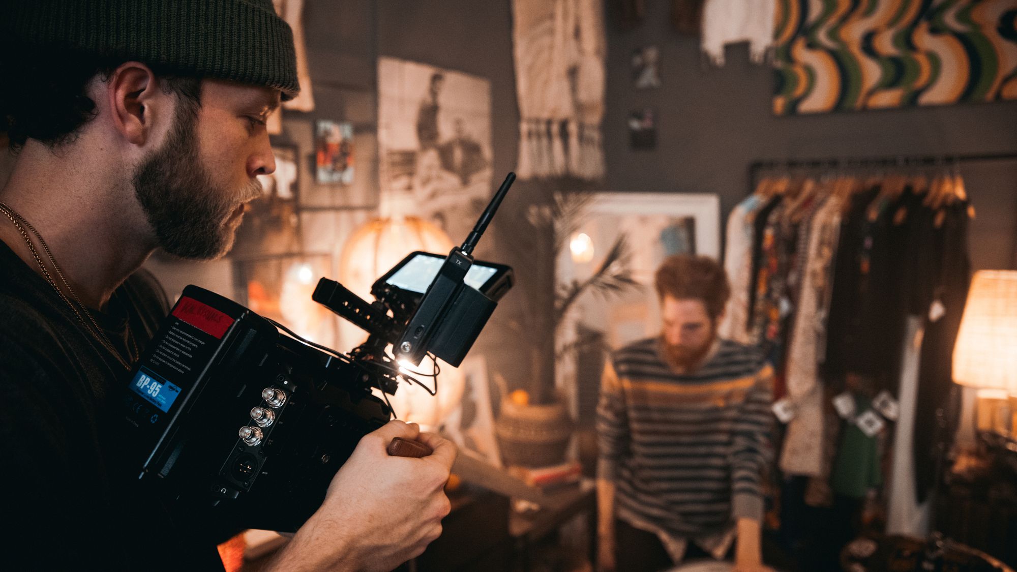 Videographer filming an interview inside a small South Florida business