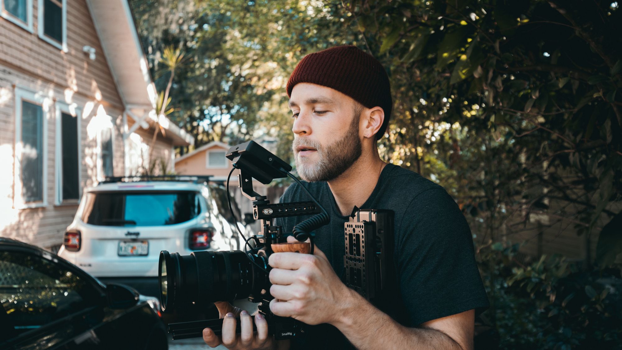 Videographer filming outside a local business storefront for a social media campaign