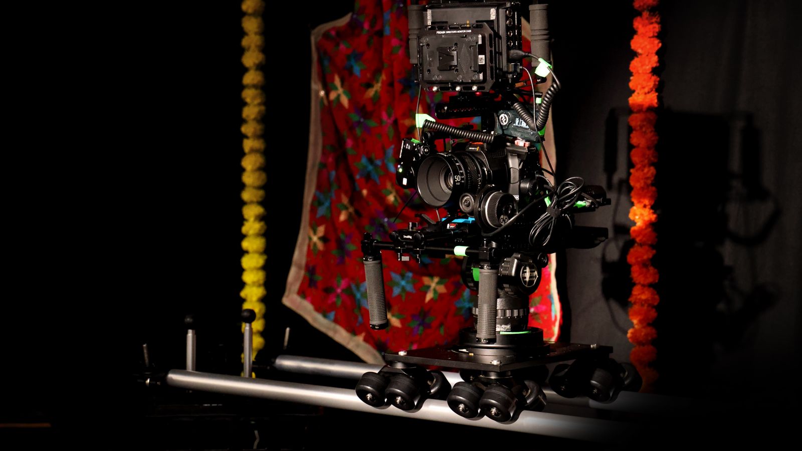 A professional camera rig setup in a vibrant studio space with colorful decorations.