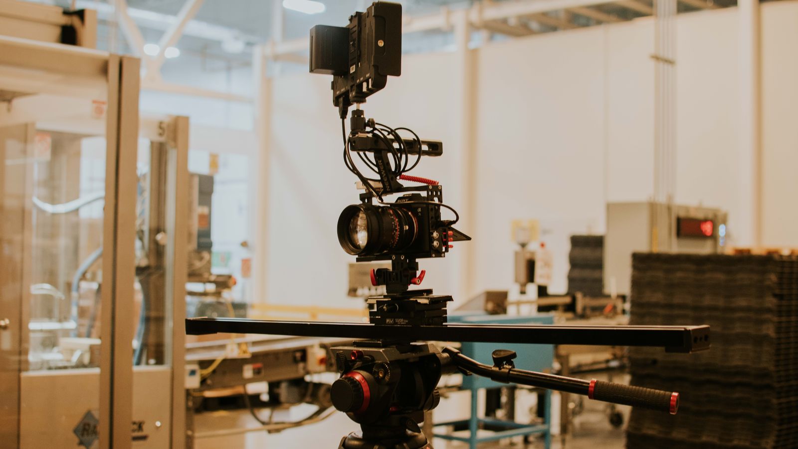 Detailed view of a camera rig set up for professional filming inside a studio setting.