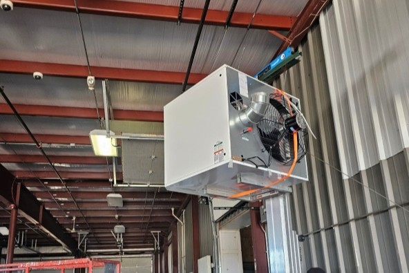 another image of a technician installing solar panels for a green tech/cleantech company
