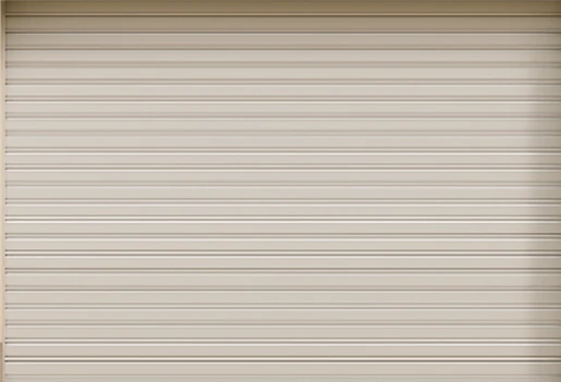 Closed beige aluminum roller garage door with horizontal ridges.