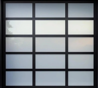 Large garage door with a black frame and frosted glass panels arranged in a grid pattern.