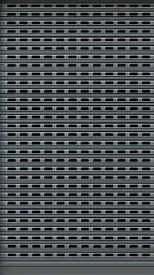 Close-up of a metallic grey shutter door with horizontal slats and rectangular holes.