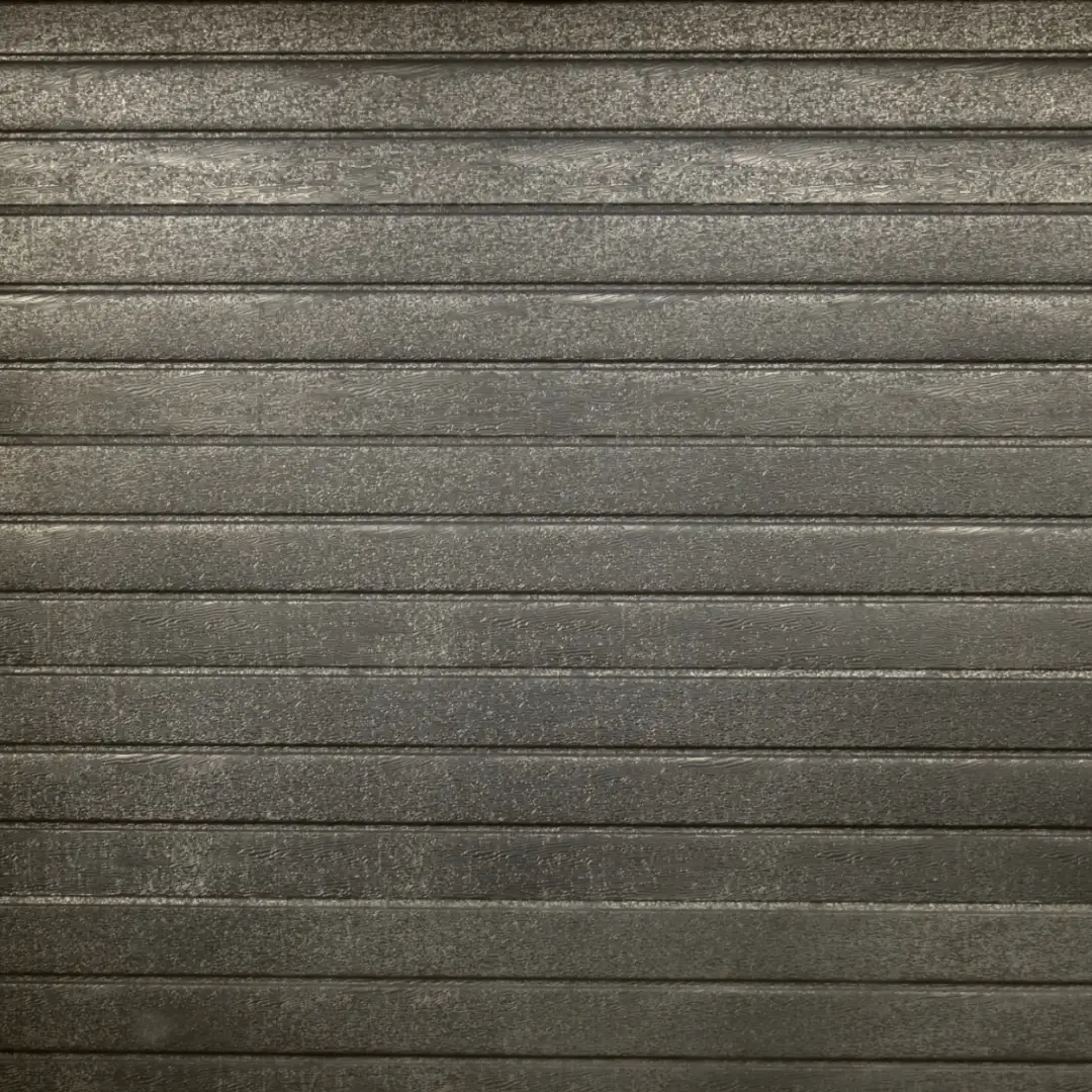 Close-up of a grey horizontal slatted steel door with a textured surface.