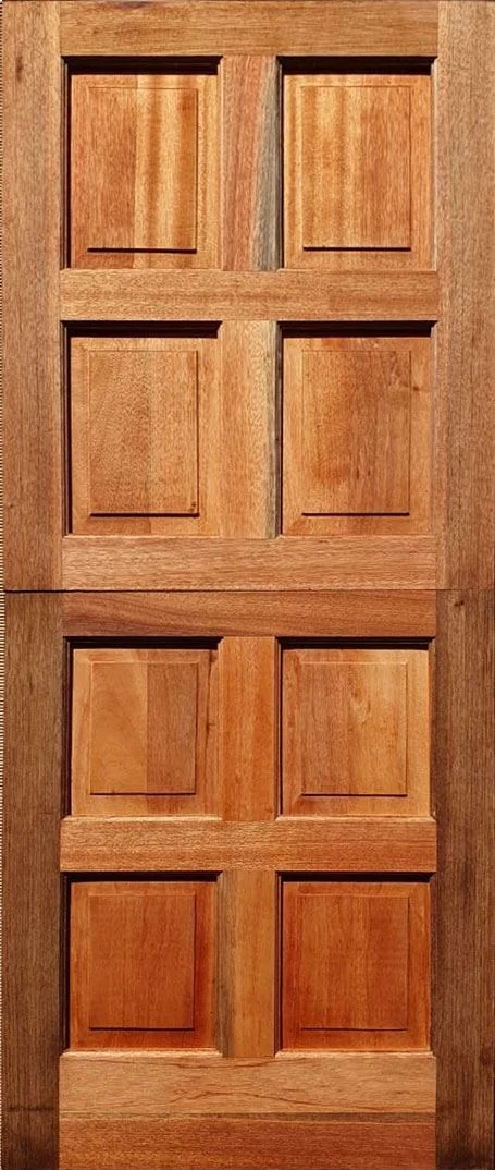Wooden door with two vertical sections, each featuring four rectangular carved panels.
