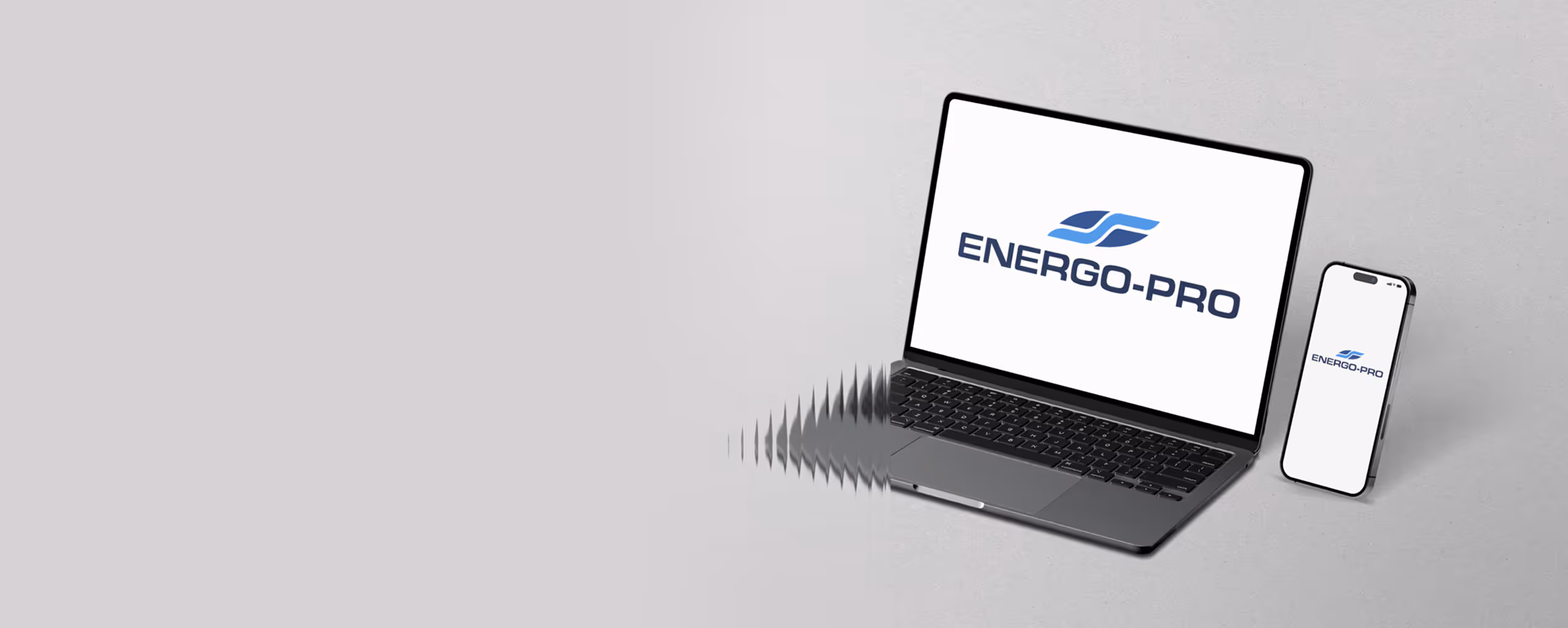 Laptop and smartphone displaying the Energo-Pro logo on their screens against a light gray background.