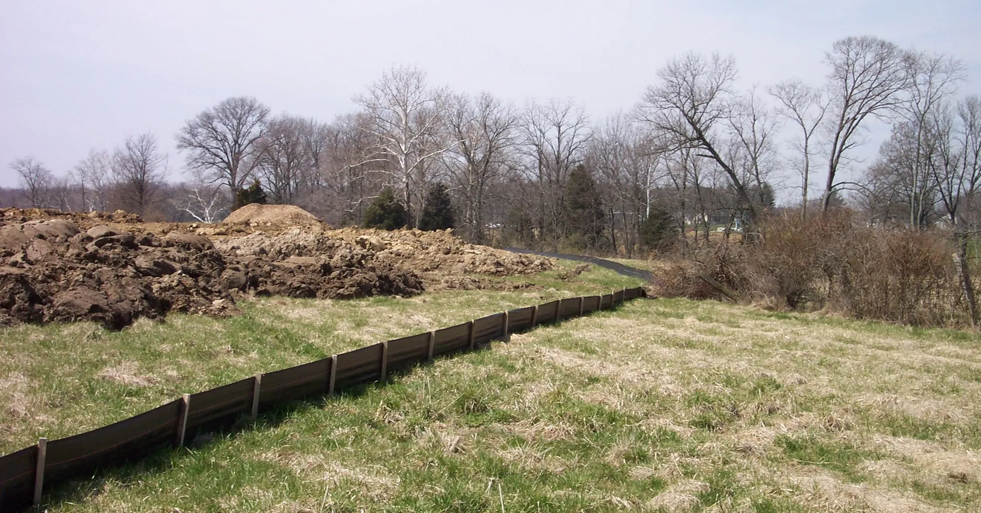 Landscape view with erosion-control fencing and stabilized soil
