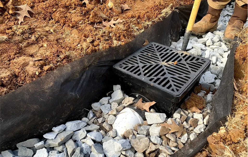 Catch basin with gravel bedding installed for yard water collection