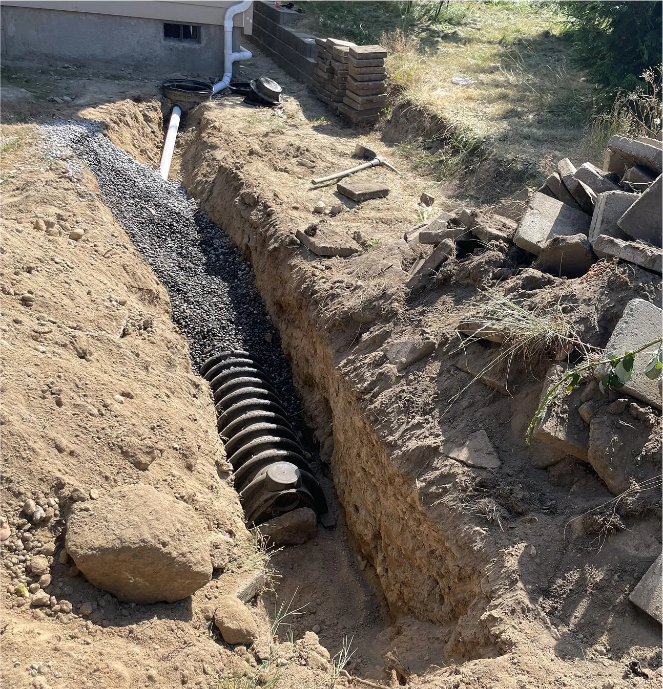 Deep trench installation of corrugated drainage pipe for stormwater control