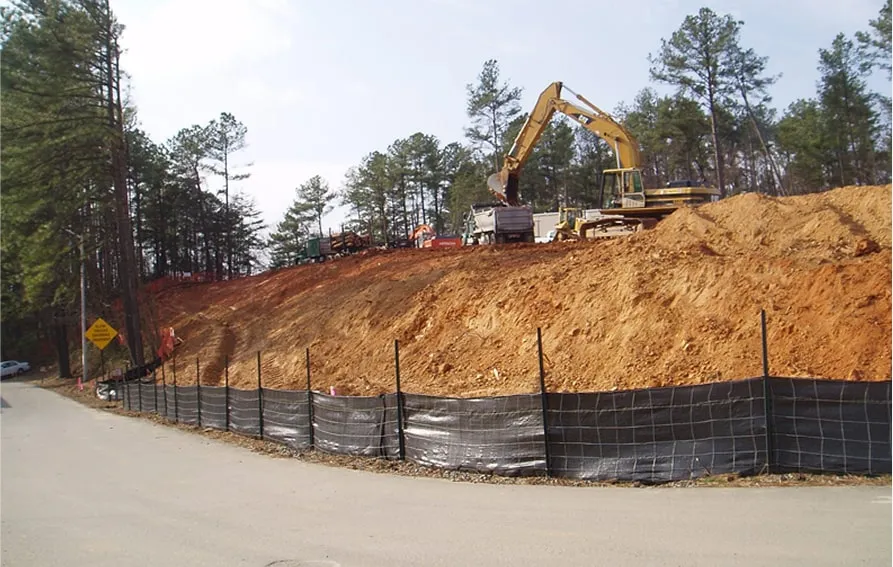 Construction site with slope stabilization and erosion-control fencing