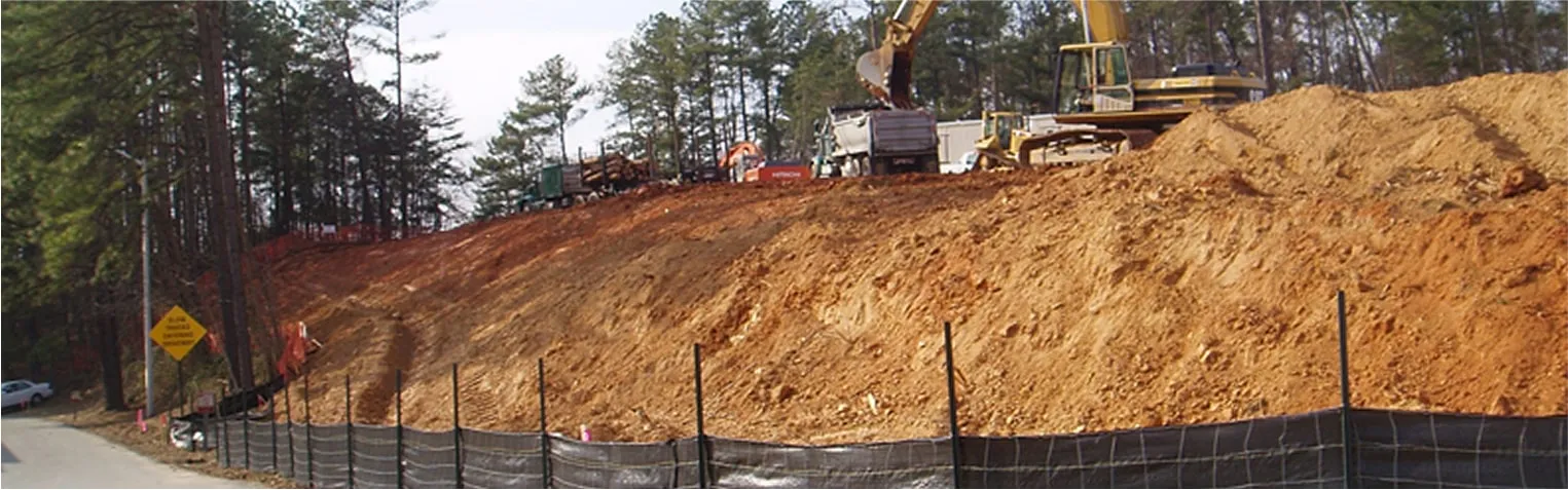 Excavated slope reinforced with erosion-control netting at construction site