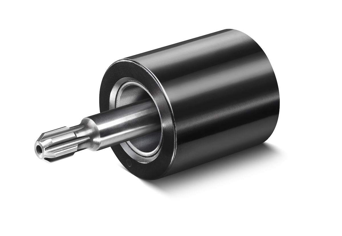 Close-up of a cylindrical metal rotor with a polished shaft and a black outer surface.