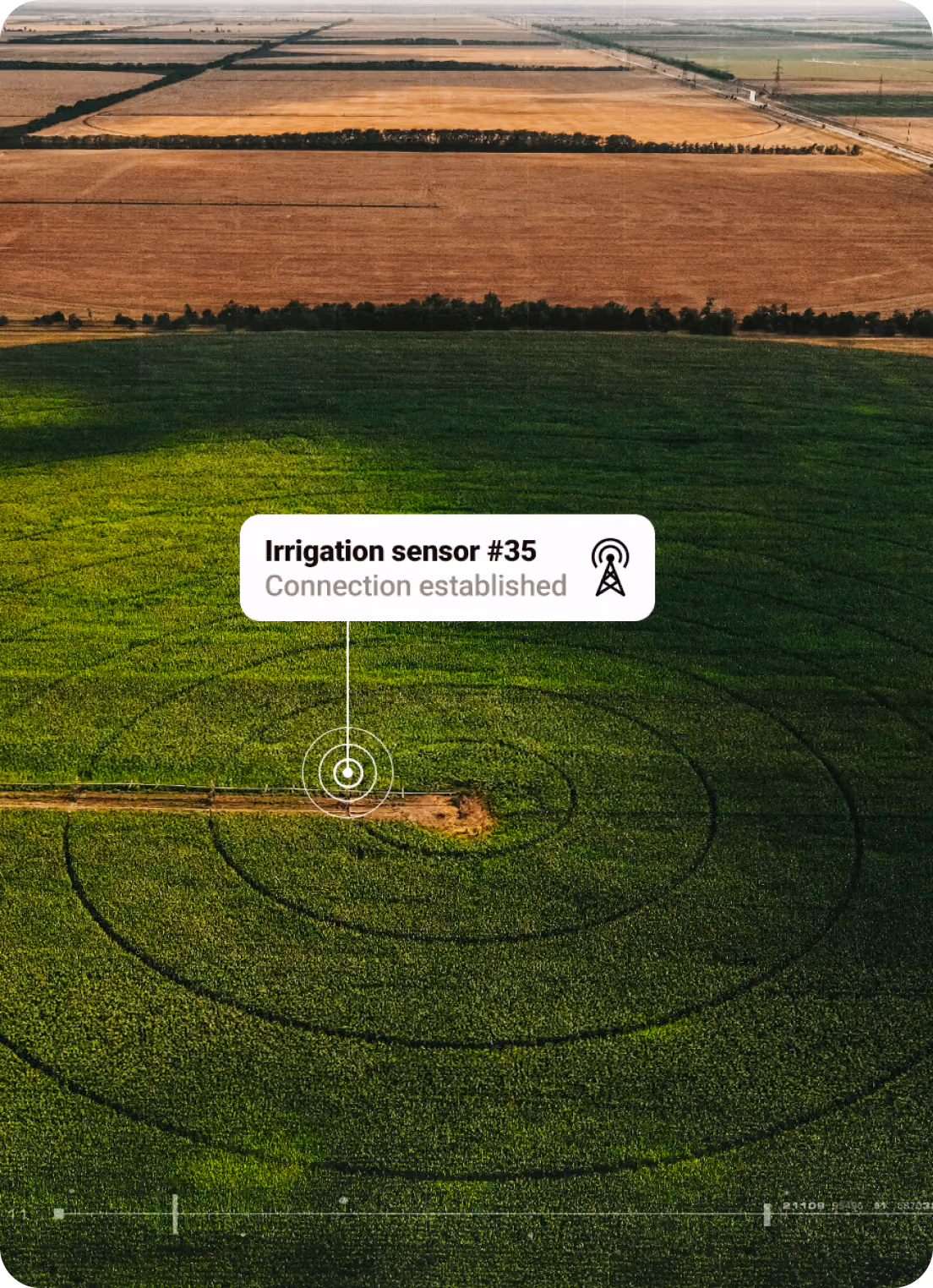 Aerial view of a green circular crop field with an irrigation sensor connection established overlay.