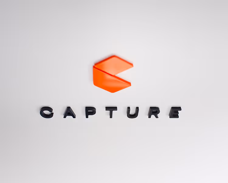 3D logo with red geometric shape above the word 'CAPTURE' in bold black letters on a white background.