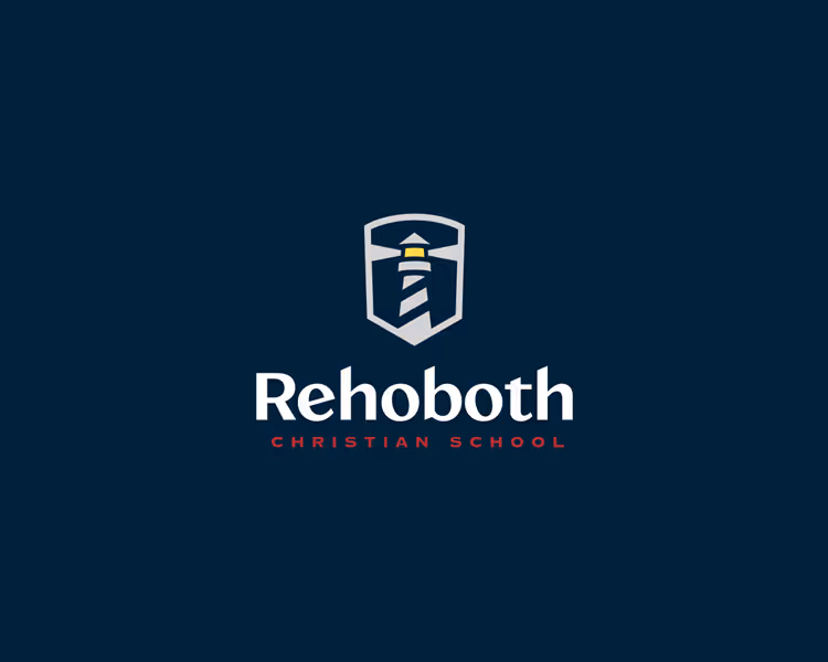 Rehoboth Christian School logo featuring a lighthouse within a shield on a dark blue background.