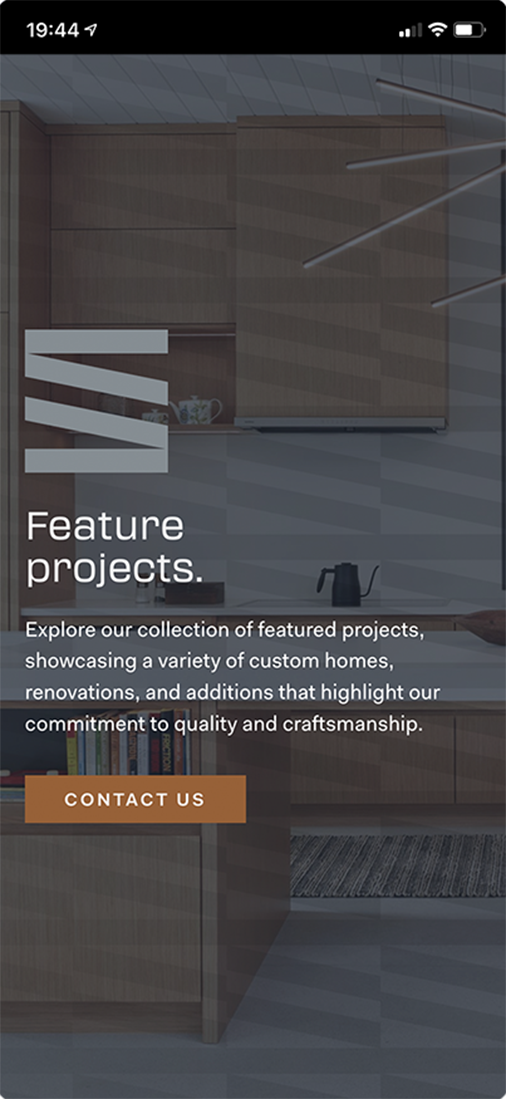 Mobile screen with overlay text promoting featured projects showcasing custom homes, renovations, and additions, with a contact us button.