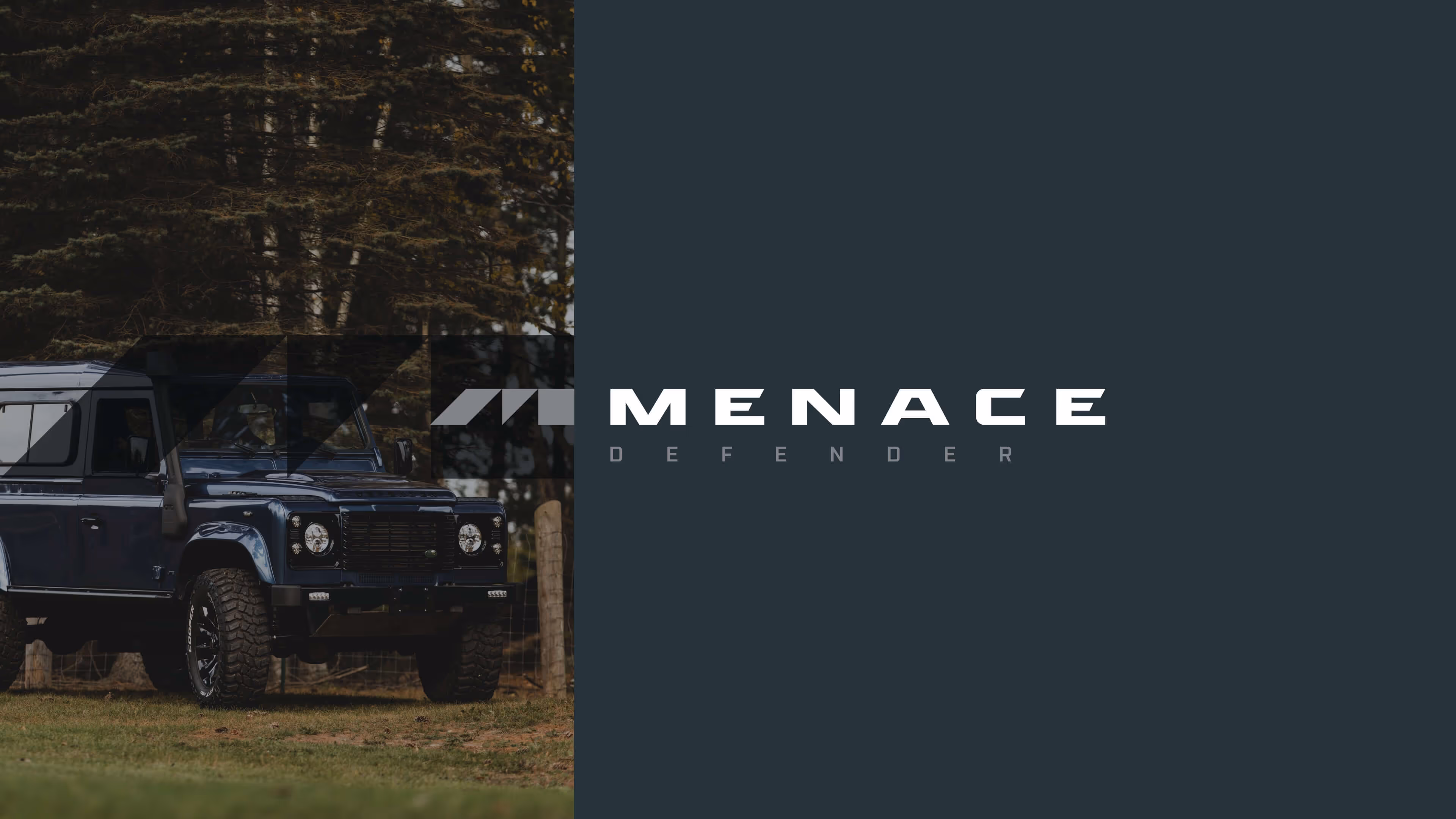 Dark blue Land Rover Defender parked on grass with trees in the background and Menace Defender logo on a dark panel to the right.