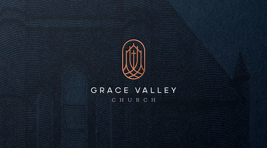 Logo of Grace Valley Church featuring a stylized cross within an oval frame on a textured dark background.