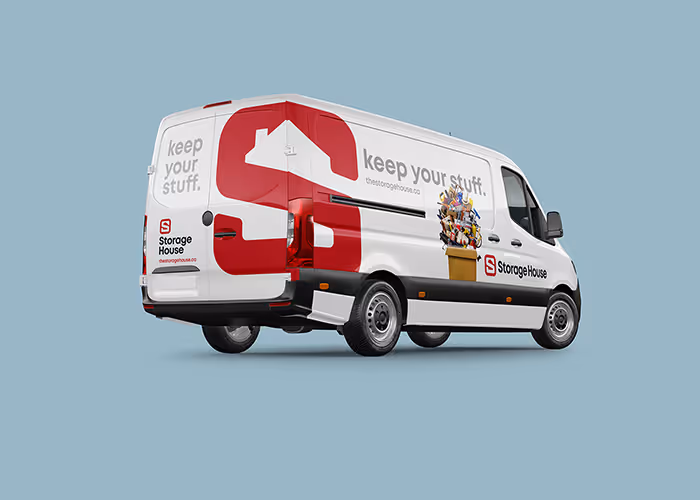 White Storage House van with red logo and slogan 'keep your stuff' against a light blue background.