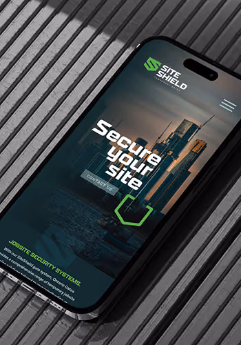 Smartphone displaying Site Shield website with slogan 'Secure Your Site' and cityscape background.