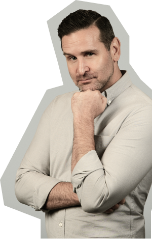 Audience seated in a conference room watching a speaker and presentation titled 'The Million Dollar Referral Machine Framework'.