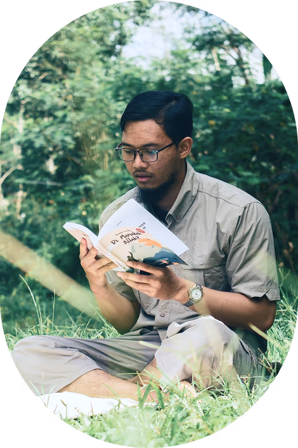 Researcher reading a book in nature