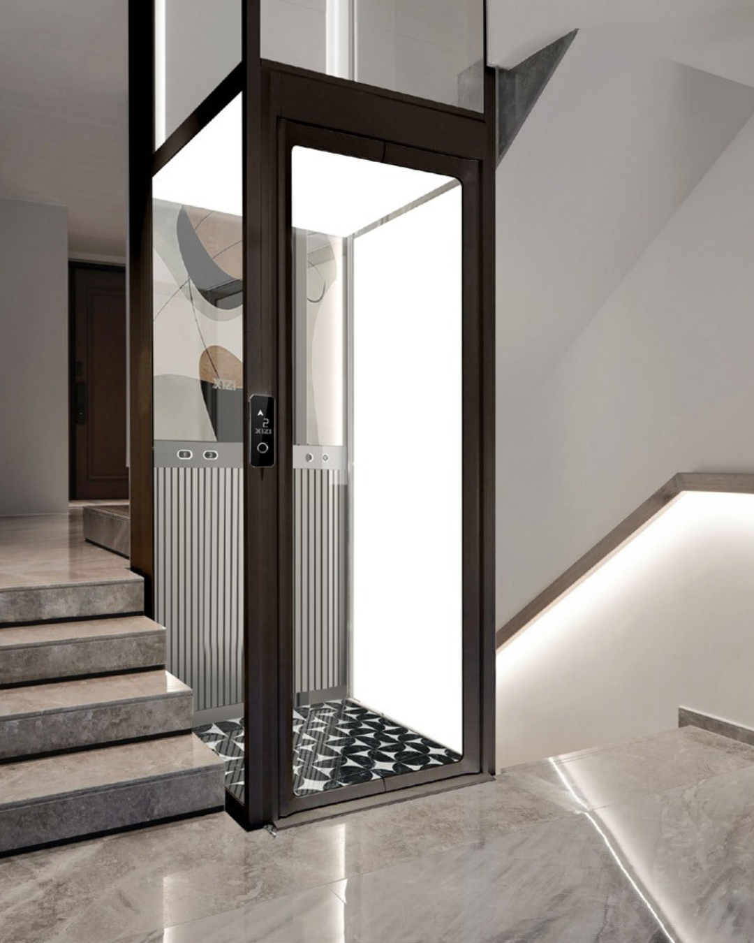 Modern residential elevator with glass door next to a marble staircase and illuminated wall trim.